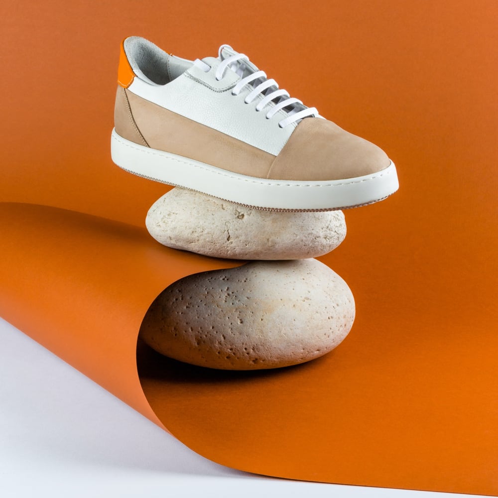 One shoe balancing on a single rock